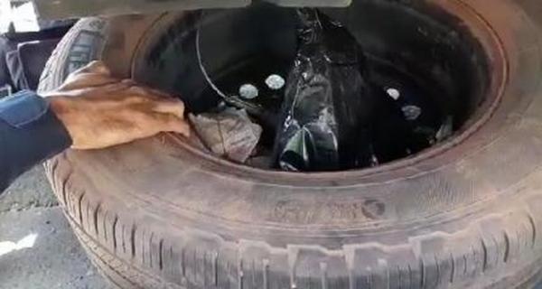 Dinheiro foi encontrado em pneu reserva do veículo durante fiscalização da PRF em Teresina.(Imagem:Divulgação/PRF-PI)
