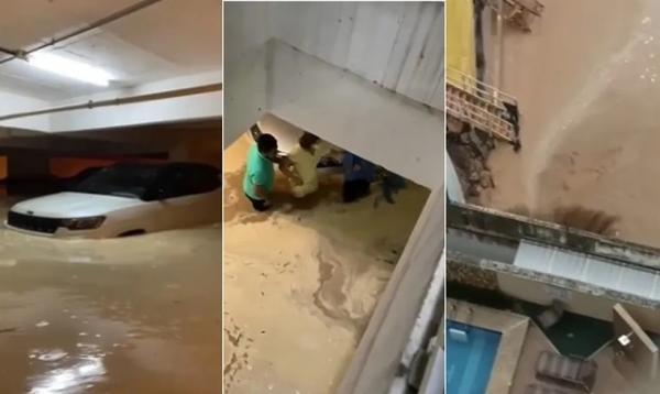 Muro rompe, água da chuva invade estacionamento e carros ficam quase submersos em condomínio de luxo(Imagem:Reprodução)