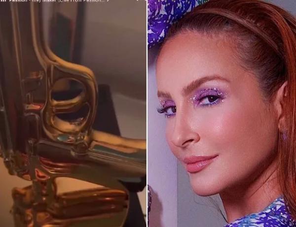 Claudia Leitte é criticada por postar abajur em formato de arma sobre bíblia.(Imagem:Reprodução/Twitter)